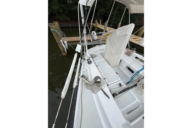 Slide: The Image of 1988 Sparkman & Stephens 36 sailboat docked, showcasing deck and rigging details. - 16
