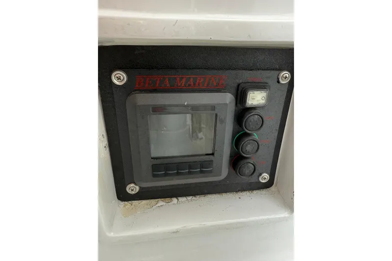 Slide: The Image of Control panel of a 1988 Sparkman & Stephens 36 sailboat, featuring Beta Marine display. - 19