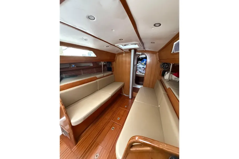Slide: The Image of Interior of 1988 Sparkman & Stephens 36 sailboat with wooden finish and beige seating. - 23