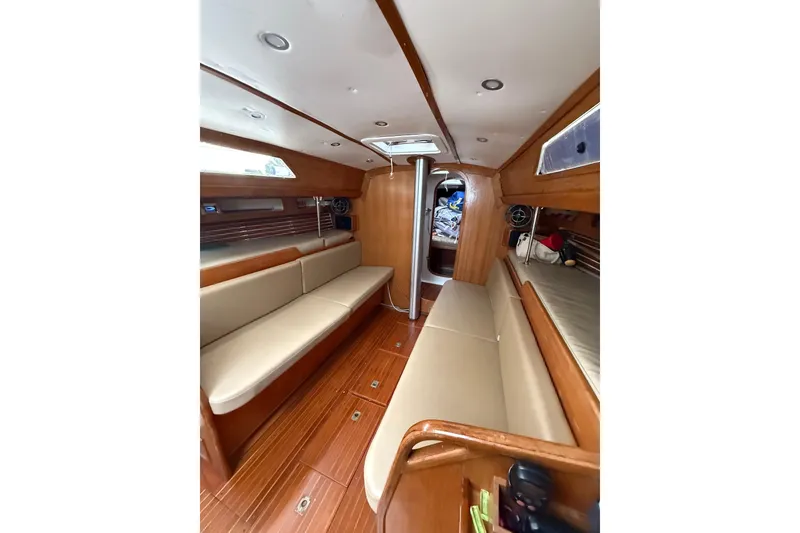 Slide: The Image of Interior of 1988 Sparkman & Stephens 36 sailboat with wooden finish and beige seating. - 24