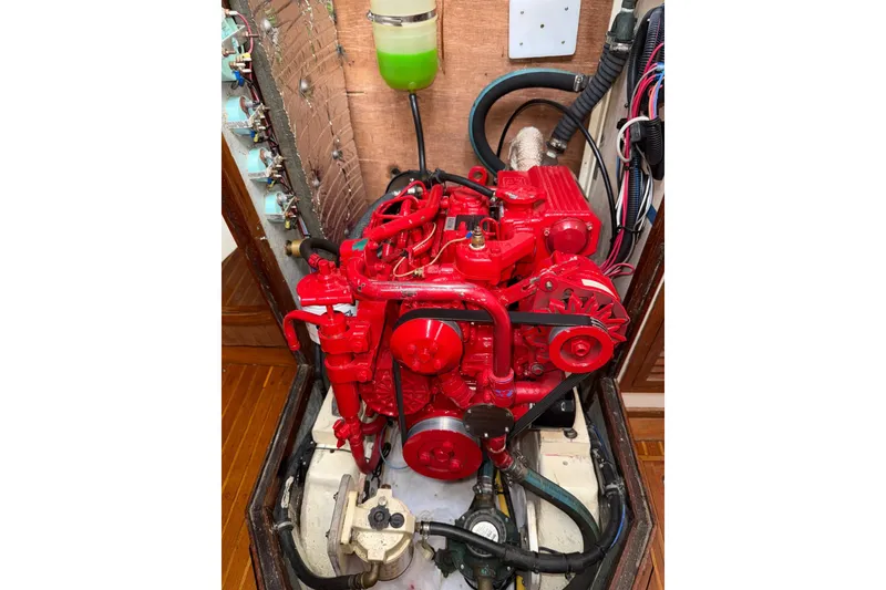 Slide: The Image of Red engine of a 1988 Sparkman & Stephens 36 sailboat, detailed view. - 30
