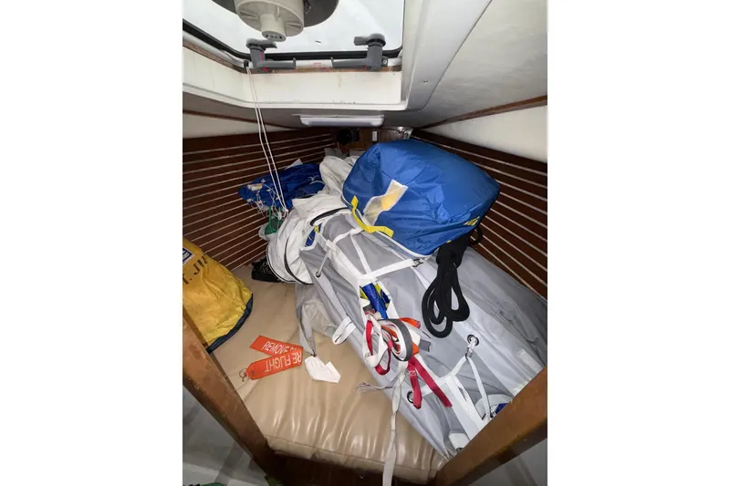 Slide: The Image of Interior of 1988 Sparkman & Stephens 36 sailboat with stored sails and equipment. - 34