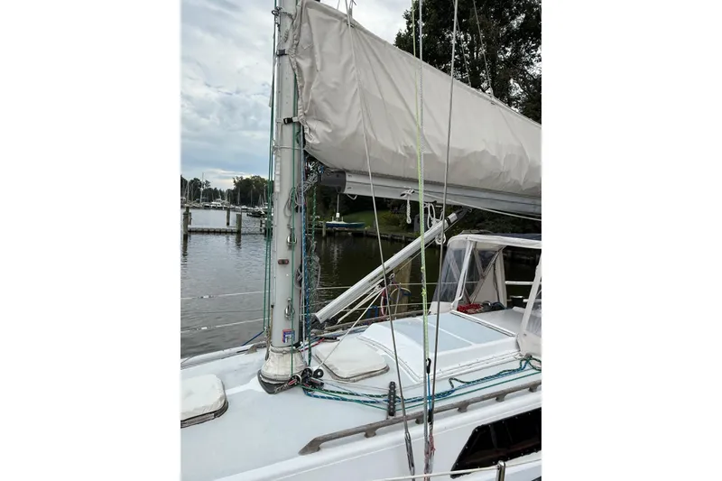 Slide: The Image of Sailboat deck view of 1988 Sparkman & Stephens 36, docked by a calm marina. - 4