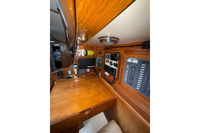 Slide: The Image of Navigation station of 1988 Sparkman & Stephens 36 yacht with control panels and equipment. - 40