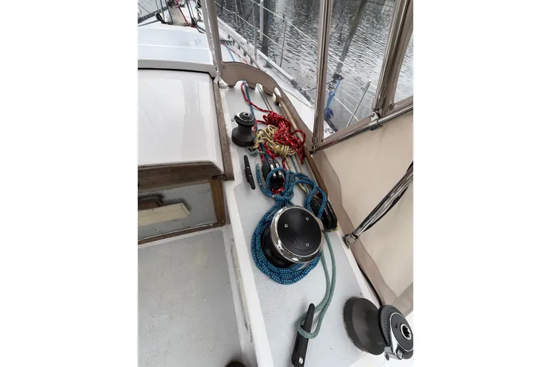 Slide: The Image of Deck of 1988 Sparkman & Stephens 36 sailboat with ropes and winches. - 45