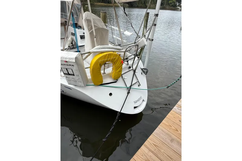 Slide: The Image of Sailboat docked, Sparkman & Stephens 36, 1988 model, with lifesaving equipment. - 8