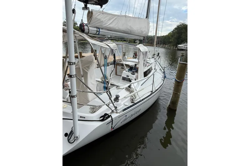 Slide: The Image of 1988 Sparkman & Stephens 36 sailboat docked on calm water. - 9
