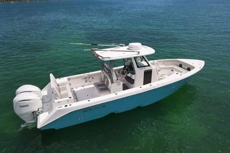 Slide: The Image of 2026 Solace 30 CS boat on clear water, featuring twin Yamaha engines. - 4
