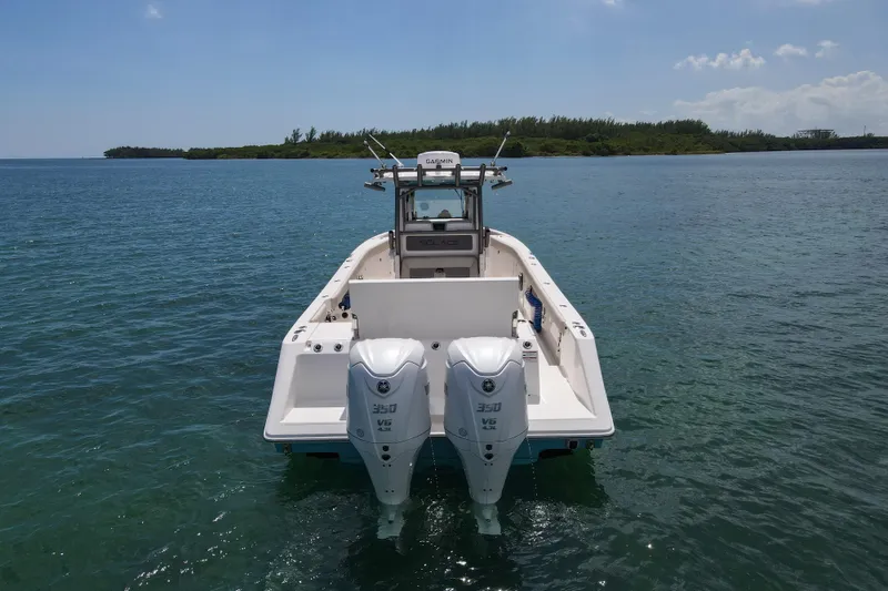 Slide: The Image of 2026 Solace 30 CS boat with dual engines on calm water. - 5