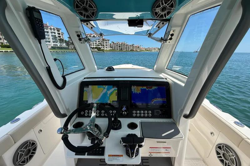 Slide: The Image of Interior view of 2026 Solace 30 CS boat cockpit with navigation screens. - 6