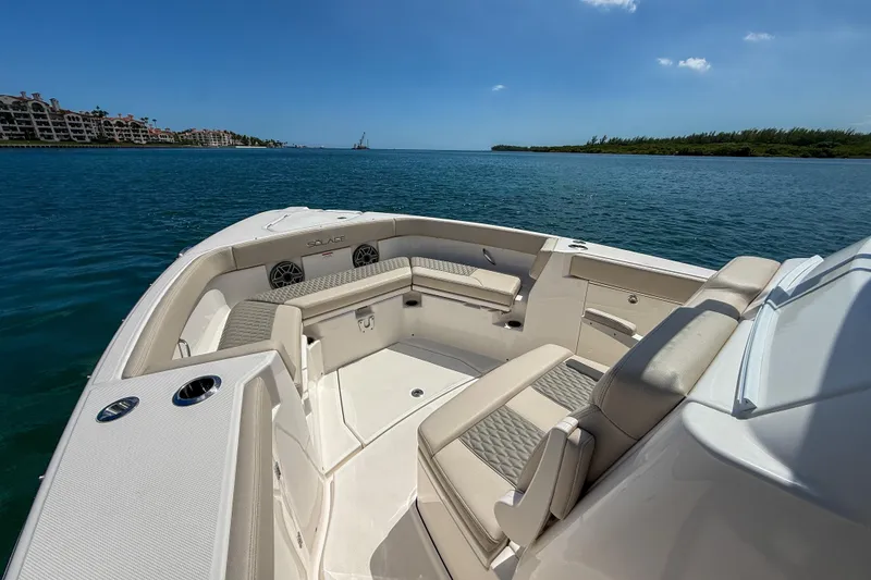 Slide: The Image of Luxurious 2026 Solace 30 CS boat interior with comfortable seating, cruising on a sunny day. - 9