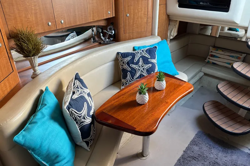 Slide: The Image of Luxurious 2006 Sea Ray Sundancer 320 cabin interior with stylish seating and decorative pillows. - 11
