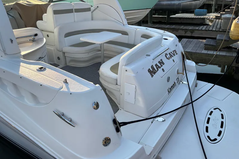 Slide: The Image of 2006 Sea Ray Sundancer 320 boat with "Man Cave" name, docked at marina. - 6