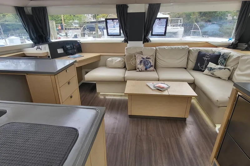 Slide: The Image of Interior of 2018 Fountaine Pajot Helia 44 catamaran with modern seating and decor. - 2