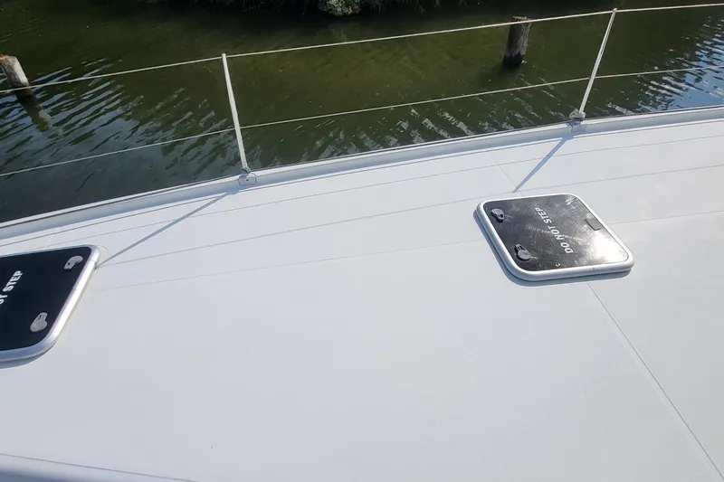 Slide: The Image of Deck of 2018 Fountaine Pajot Helia 44 catamaran with hatches and railing. - 29