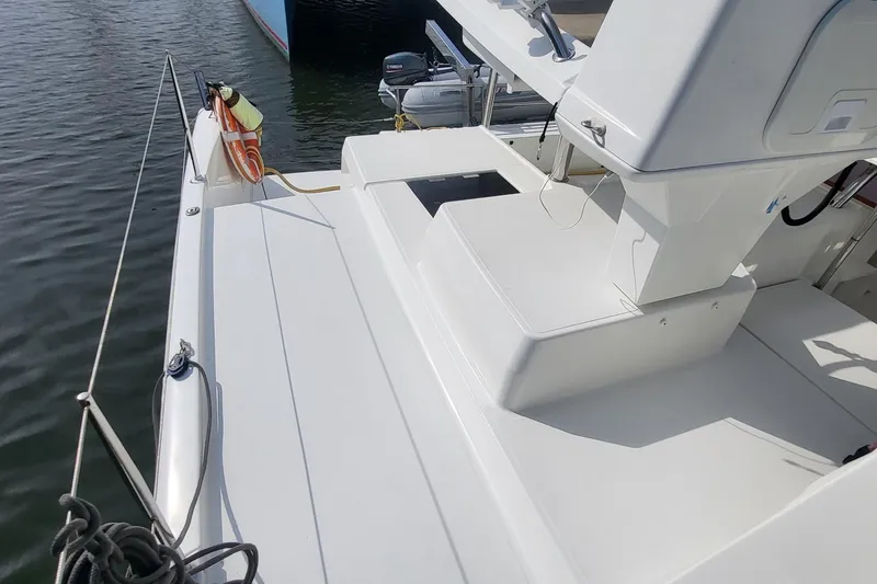 Slide: The Image of 2018 Fountaine Pajot Helia 44 catamaran deck, featuring sleek white design and modern amenities. - 33