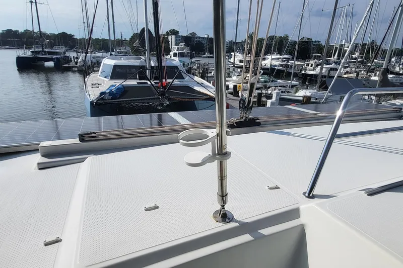 Slide: The Image of 2018 Fountaine Pajot Helia 44 catamaran docked at marina with solar panels. - 37