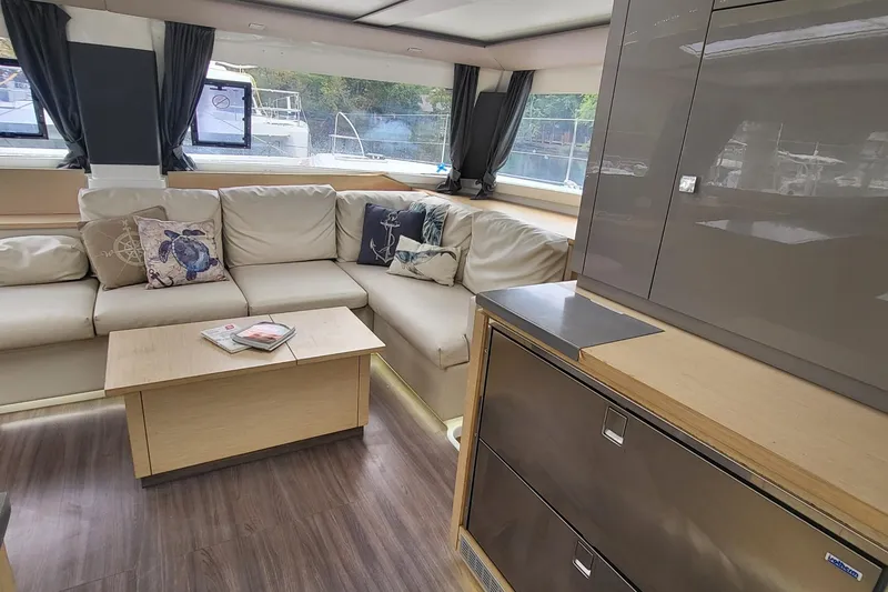 Slide: The Image of Luxurious interior of 2018 Fountaine Pajot Helia 44 catamaran with modern furnishings and ample seating. - 4