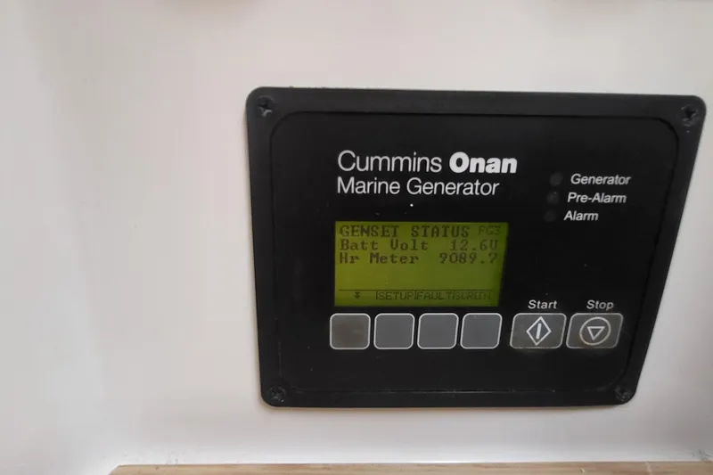 Slide: The Image of Cummins Onan marine generator display on 2018 Fountaine Pajot Helia 44, showing battery voltage. - 44