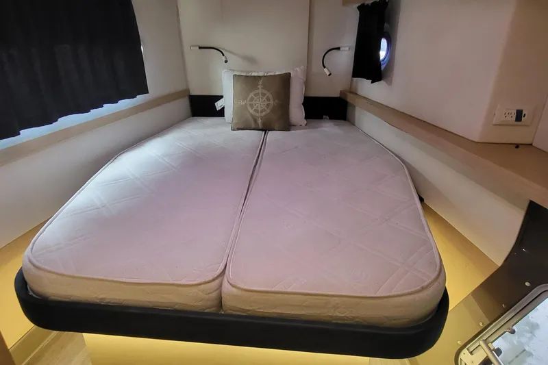 Slide: The Image of Cabin interior of 2018 Fountaine Pajot Helia 44 catamaran with cozy bed and nautical decor. - 48