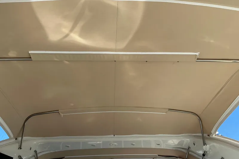 Slide: The Image of 2003 Regal Commodore 4260 boat canopy with metal support bars. - 21