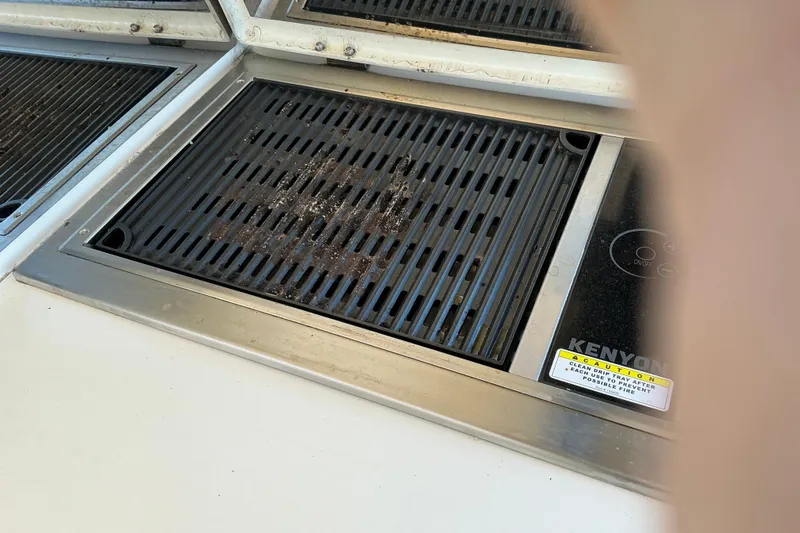 Slide: The Image of Built-in Kenyon grill on 2003 Regal Commodore 4260 yacht, featuring a sleek design. - 27