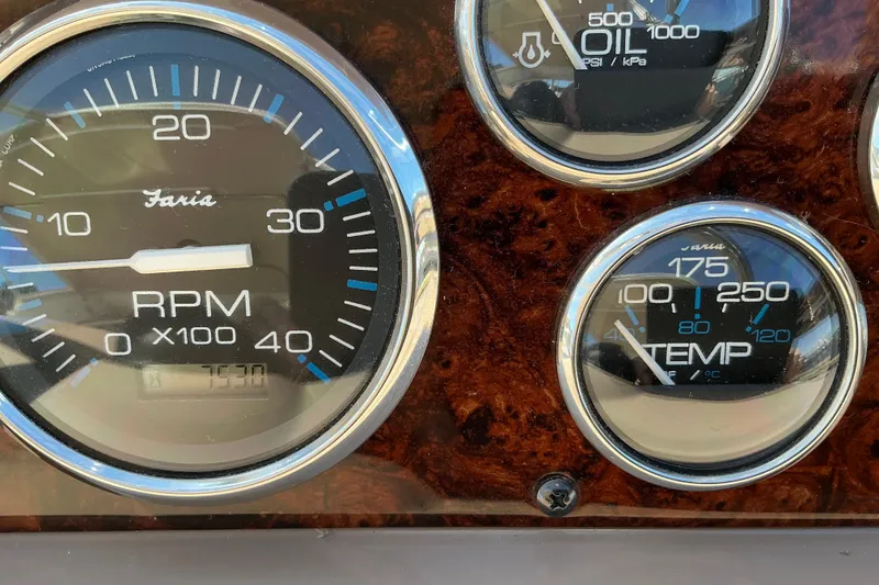 Slide: The Image of Close-up of 2003 Regal Commodore 4260 dashboard gauges, showing RPM, oil pressure, and temperature. - 29