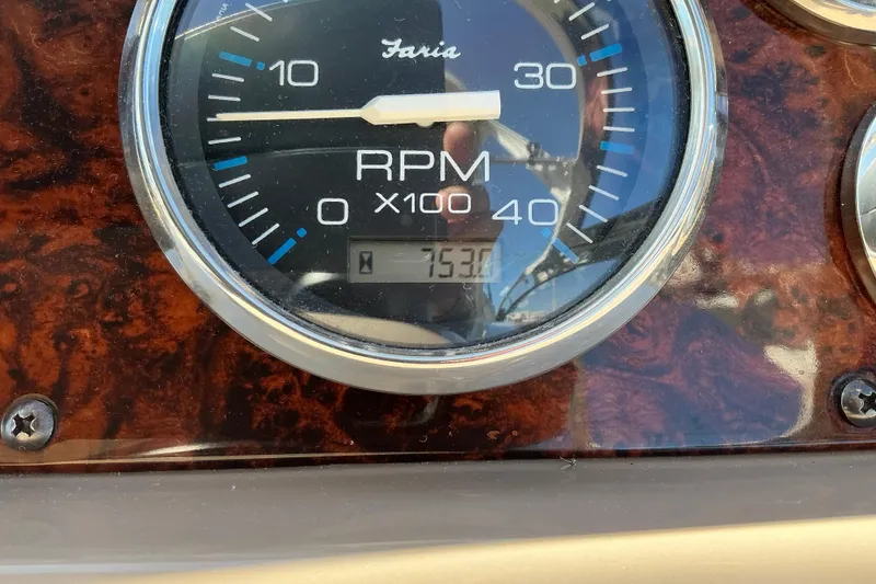 Slide: The Image of Close-up of a 2003 Regal Commodore 4260 RPM gauge displaying 753 hours. - 32