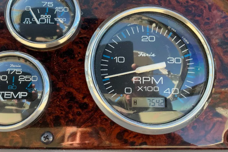 Slide: The Image of Close-up of 2003 Regal Commodore 4260 dashboard gauges, showing RPM, oil, and temperature. - 33