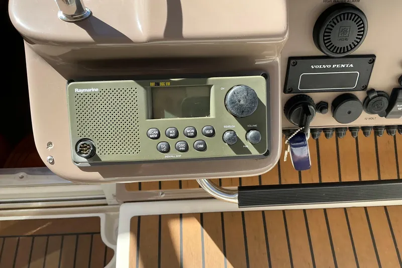 Slide: The Image of Control panel of a 2003 Regal Commodore 4260 with Raymarine VHF radio and Volvo Penta system. - 36