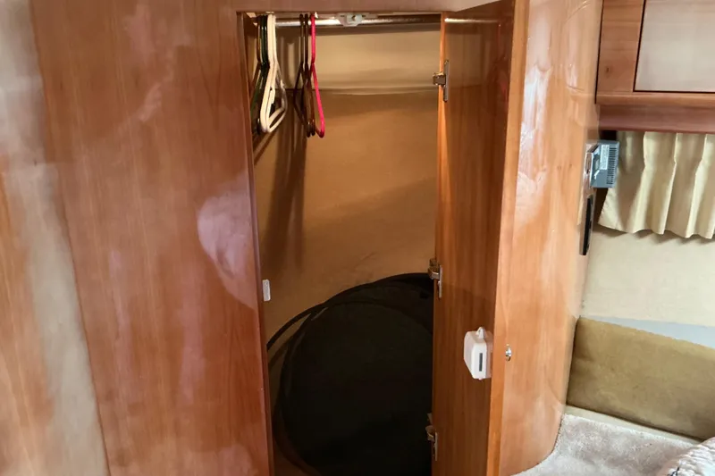Slide: The Image of Wooden closet interior on a 2003 Regal Commodore 4260 yacht. - 39