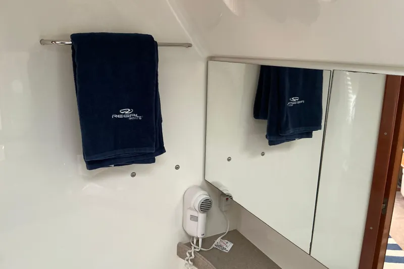 Slide: The Image of Bathroom interior of 2003 Regal Commodore 4260 yacht with towel and mirror. - 67