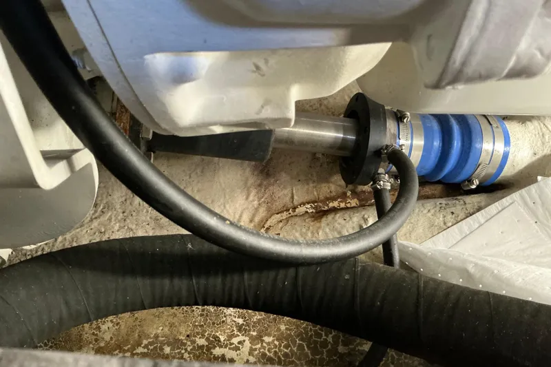 Slide: The Image of Engine compartment of 2003 Regal Commodore 4260 with visible hoses and fittings. - 79