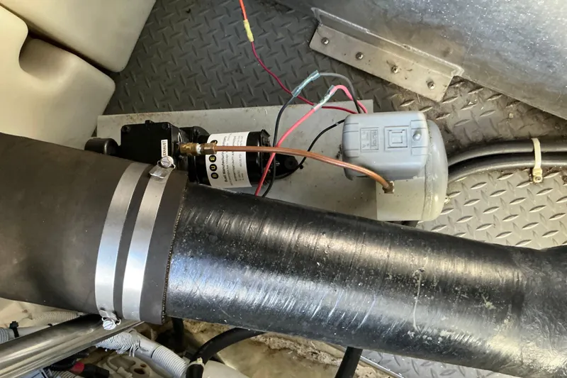 Slide: The Image of Engine compartment of 2003 Regal Commodore 4260 with wiring and components visible. - 80