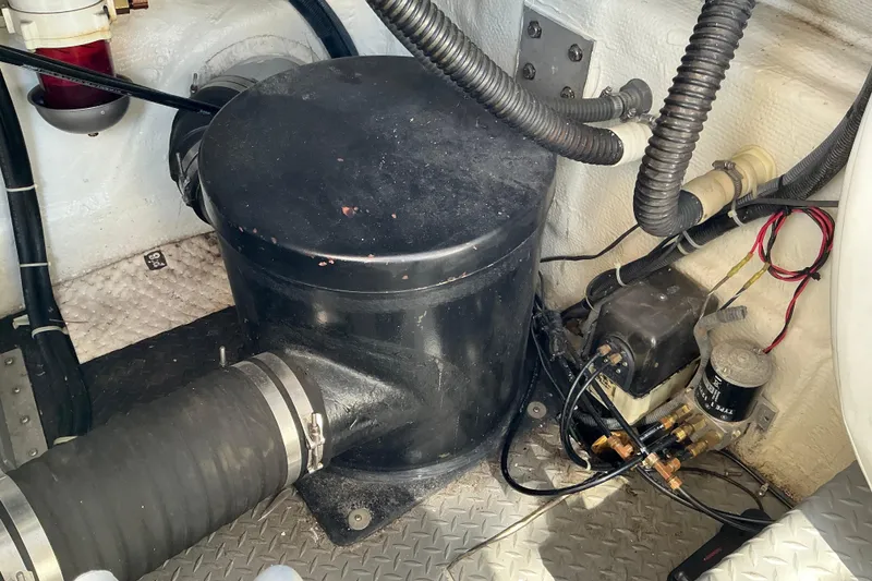 Slide: The Image of Engine compartment of 2003 Regal Commodore 4260, featuring mechanical components and wiring. - 81