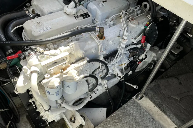 Slide: The Image of Engine compartment of a 2003 Regal Commodore 4260 boat, showcasing detailed mechanical components. - 86