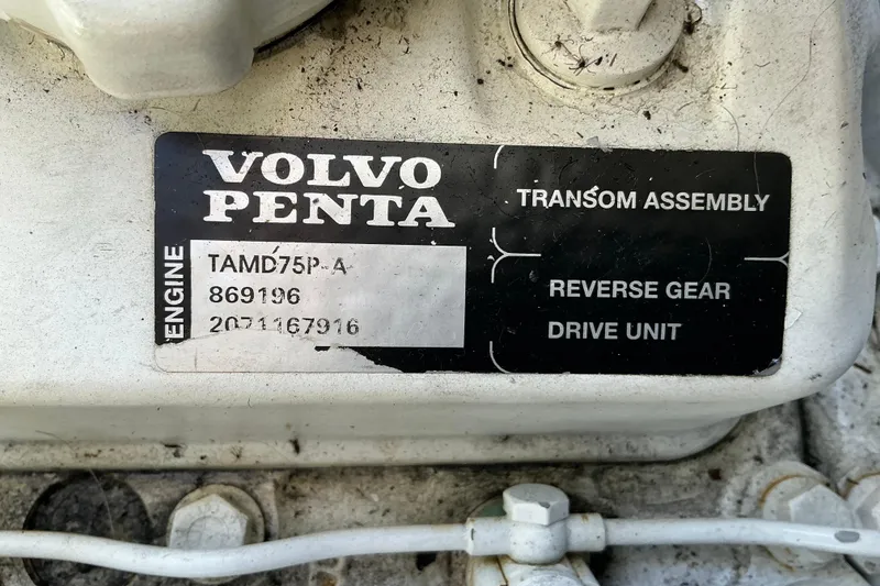 Slide: The Image of Volvo Penta engine label on 2003 Regal Commodore 4260, featuring TAMD75P-A model details. - 87