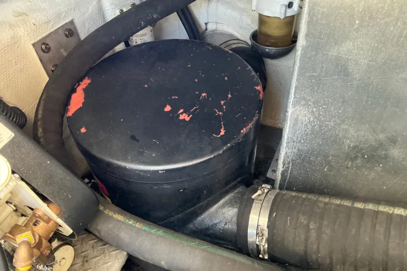 Slide: The Image of Engine compartment of 2003 Regal Commodore 4260 with hoses and components. - 89