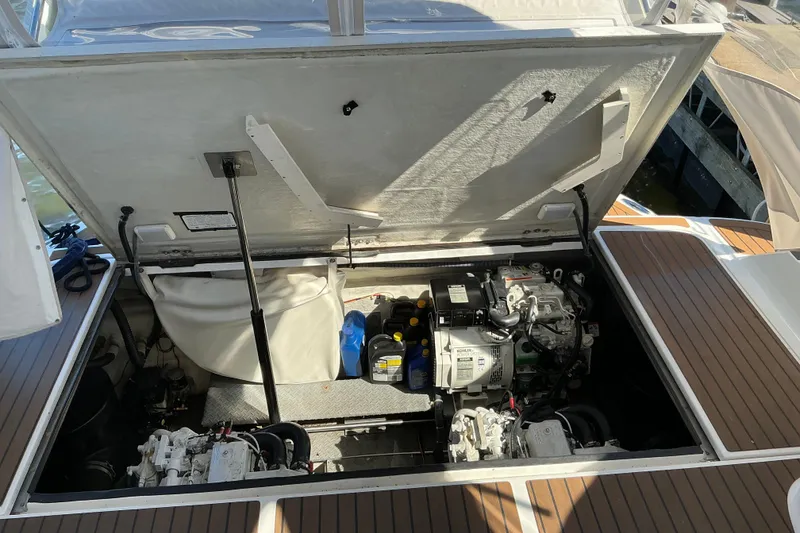 Slide: The Image of Open engine compartment of 2003 Regal Commodore 4260 boat, showing mechanical components. - 93