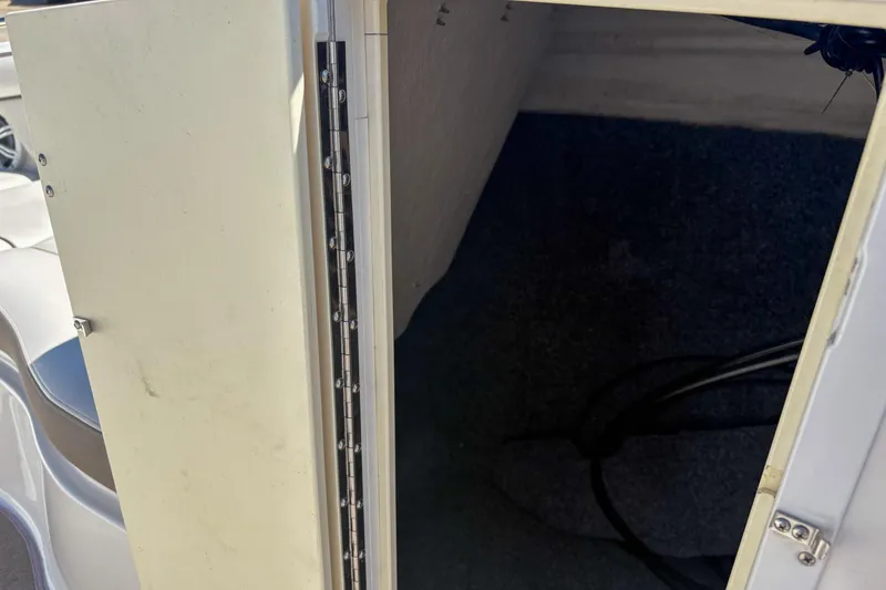 Slide: The Image of Open storage compartment on a 2013 Yamaha SX240 HO boat. - 15