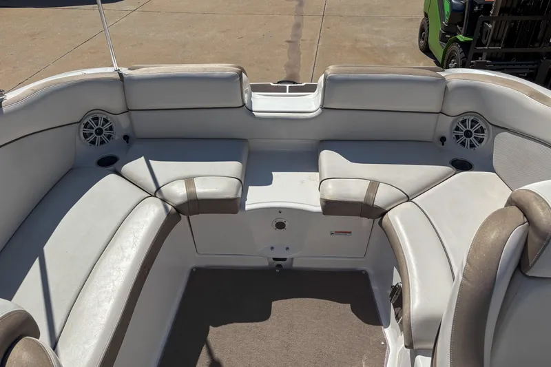 Slide: The Image of 2013 Yamaha Boats SX240 HO interior with cushioned seating and built-in speakers. - 6