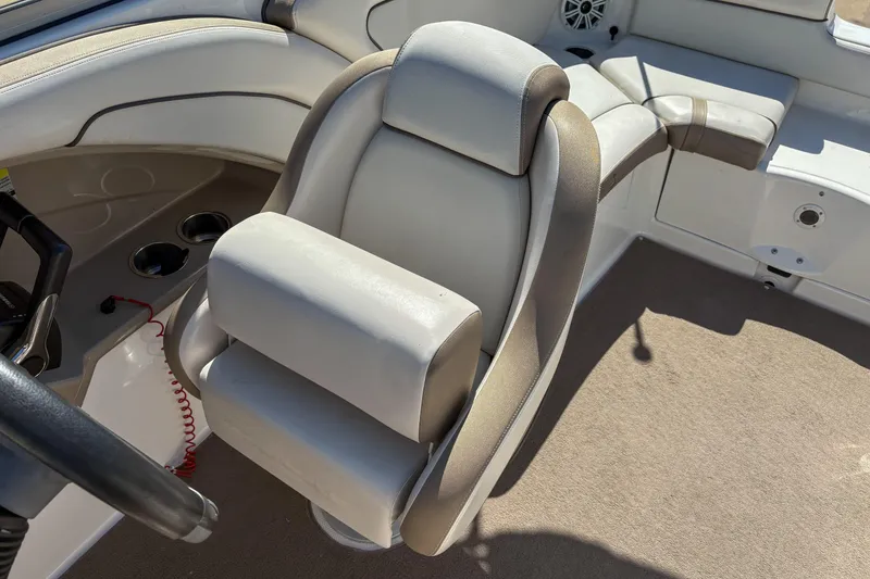 Slide: The Image of 2013 Yamaha Boats SX240 HO interior with beige seating and steering wheel. - 8