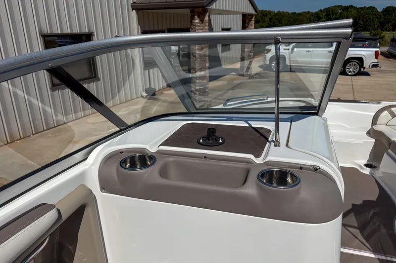 Slide: The Image of 2013 Yamaha Boats SX240 HO interior with windshield and cup holders. - 9