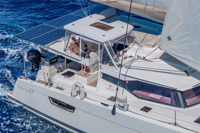 Slide: The Image of 2020 Fountaine Pajot Saona 47 catamaran sailing on blue ocean waters. - 1