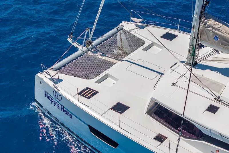 Slide: The Image of 2020 Fountaine Pajot Saona 47 catamaran sailing on clear blue ocean waters. - 10