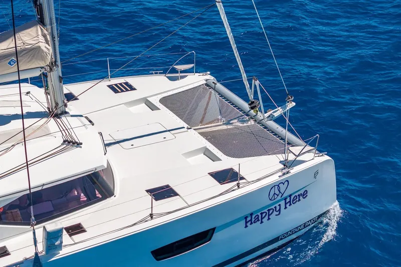 Slide: The Image of 2020 Fountaine Pajot Saona 47 catamaran sailing on clear blue ocean waters. - 11