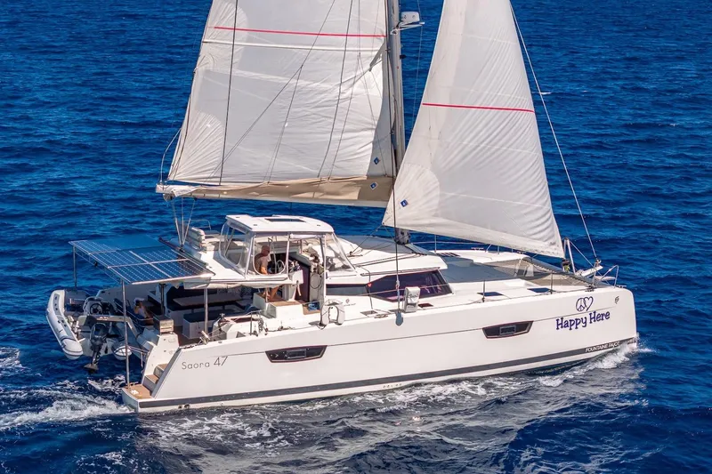 Slide: The Image of 2020 Fountaine Pajot Saona 47 catamaran sailing on open blue sea. - 12