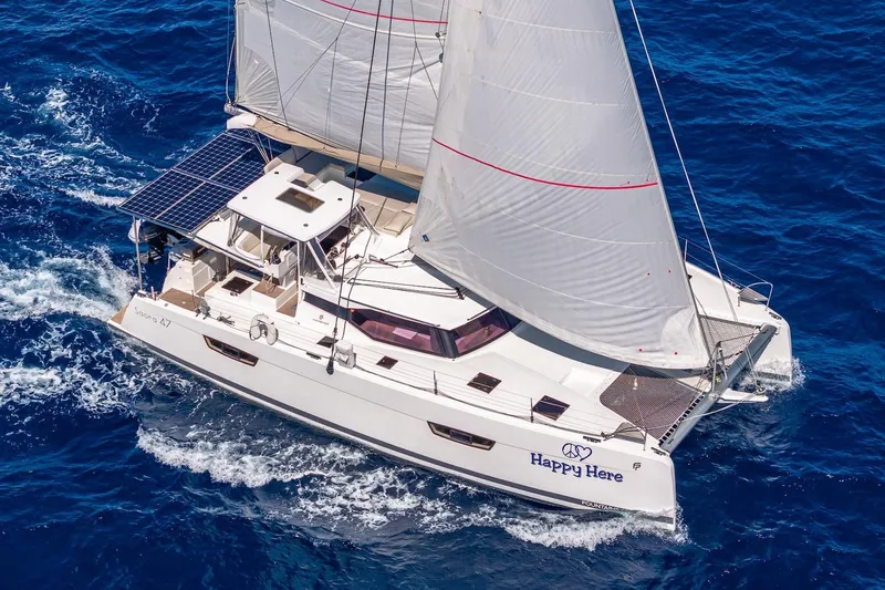 Slide: The Image of 2020 Fountaine Pajot Saona 47 sailing catamaran on open sea, featuring solar panels. - 16