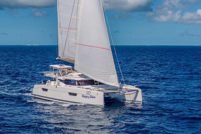 Slide: The Image of 2020 Fountaine Pajot Saona 47 catamaran sailing on open ocean under clear skies. - 17