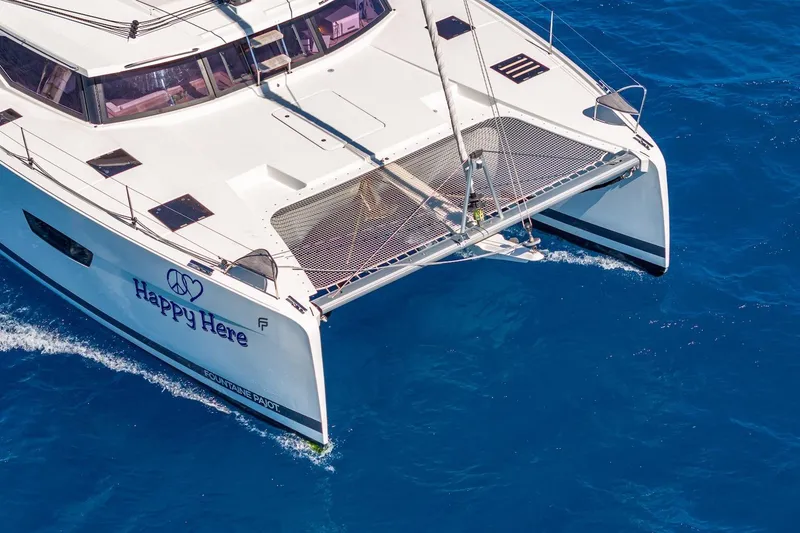 Slide: The Image of 2020 Fountaine Pajot Saona 47 catamaran sailing on clear blue ocean waters. - 18